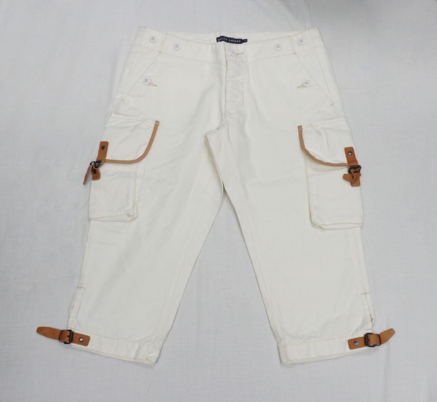 White cargo pants — leather tabs