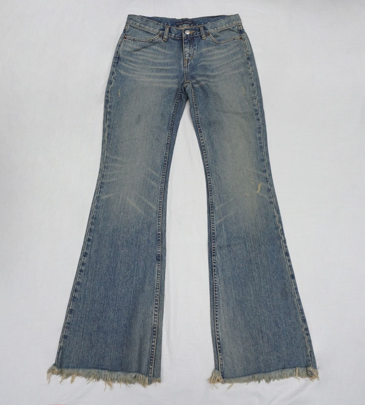 Blue flared jeans — distressed hem