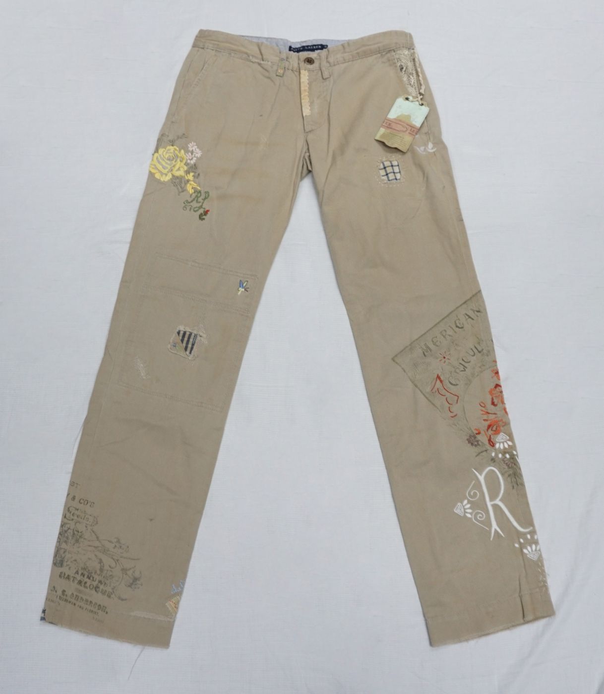 Beige trousers — floral embroidery